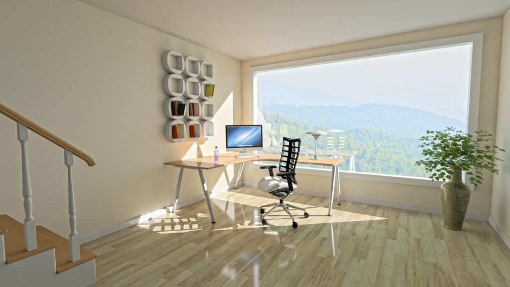 Office desk in modern home with stunning view through large window of large